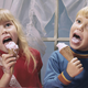 Small boy and girl eating ice cream cones